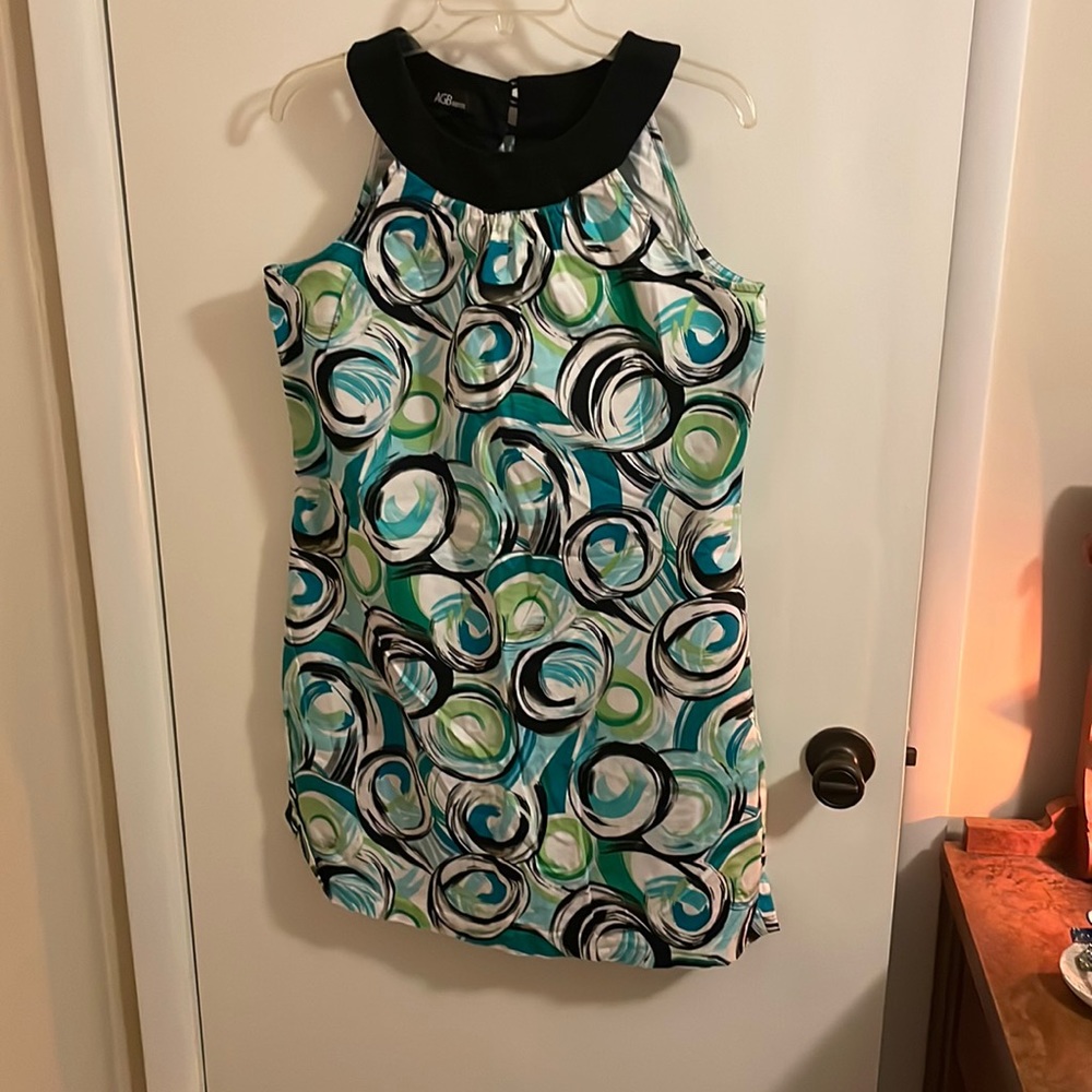 Dress with black, and different shades of green swirls